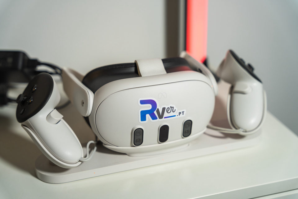 RVer headset on its charging dock, with both controllers