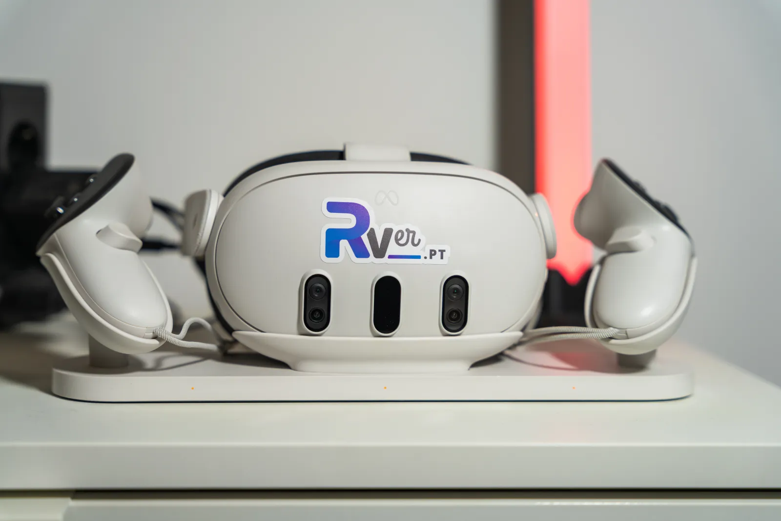 Meta Quest 3 headset with the RVer sticker and its controllers